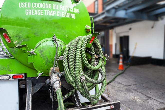 grease trap pumping truck servicing a restaurant in Bloomingdale, IL